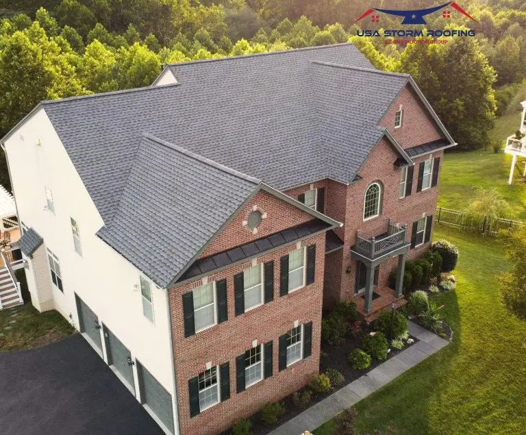 Dark shingle roof on a brick-and-siding home
