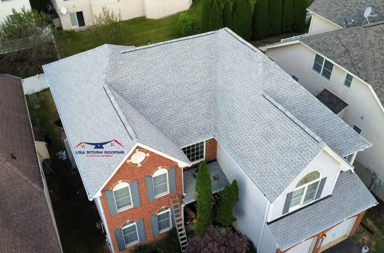 Light gray shingle roof on a brick-front home