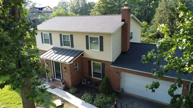 Two-story home with a porch roof and brick chimney