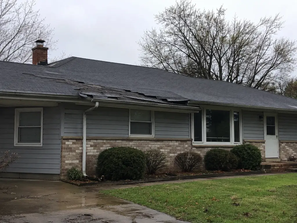 lifted shingles wind damage