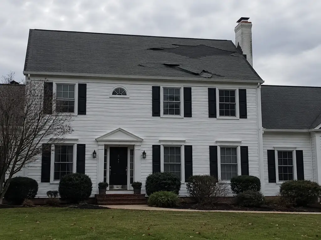 lifted shingles wind damage